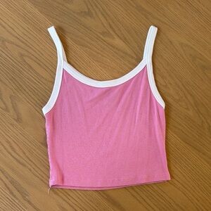 Woman’s pink and white cropped tank top